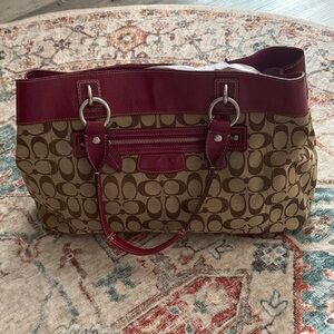 Beautiful patent leather raspberry Coach with a classic signature canvas